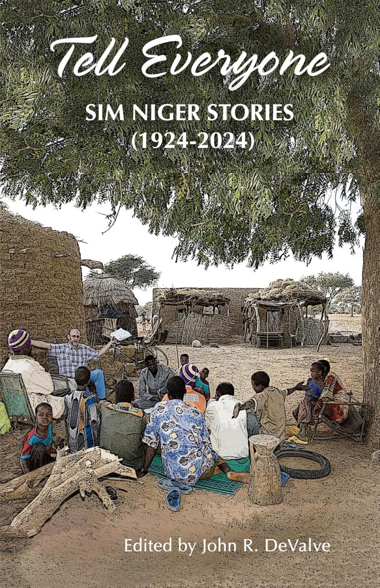 Community gathering in rural village for mission stories and discipleship.
