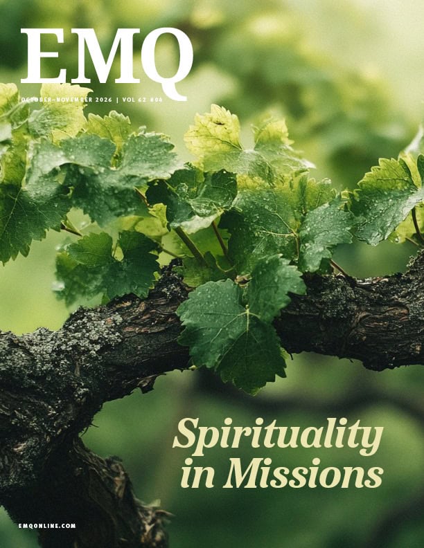 Close-up of grapevine leaves and branch on the cover of EMQ magazine.
