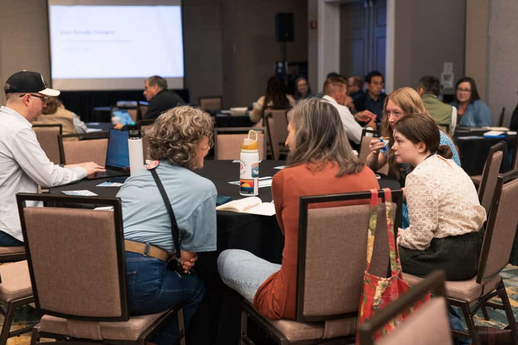 Attendees engaging in discussion at Missio Nexus conference.